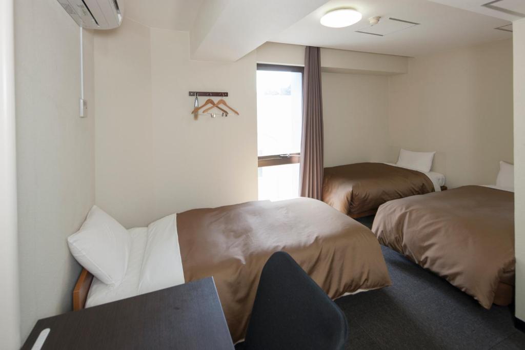 Hotel Plaza Inn Τοκουσίμα Δωμάτιο φωτογραφία